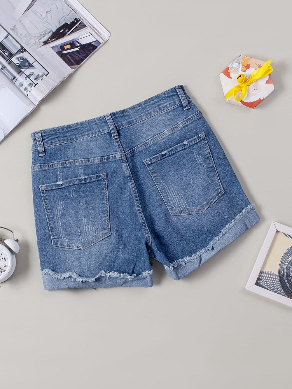 Trendy Ripped Denim Shorts with Unique Floral Design