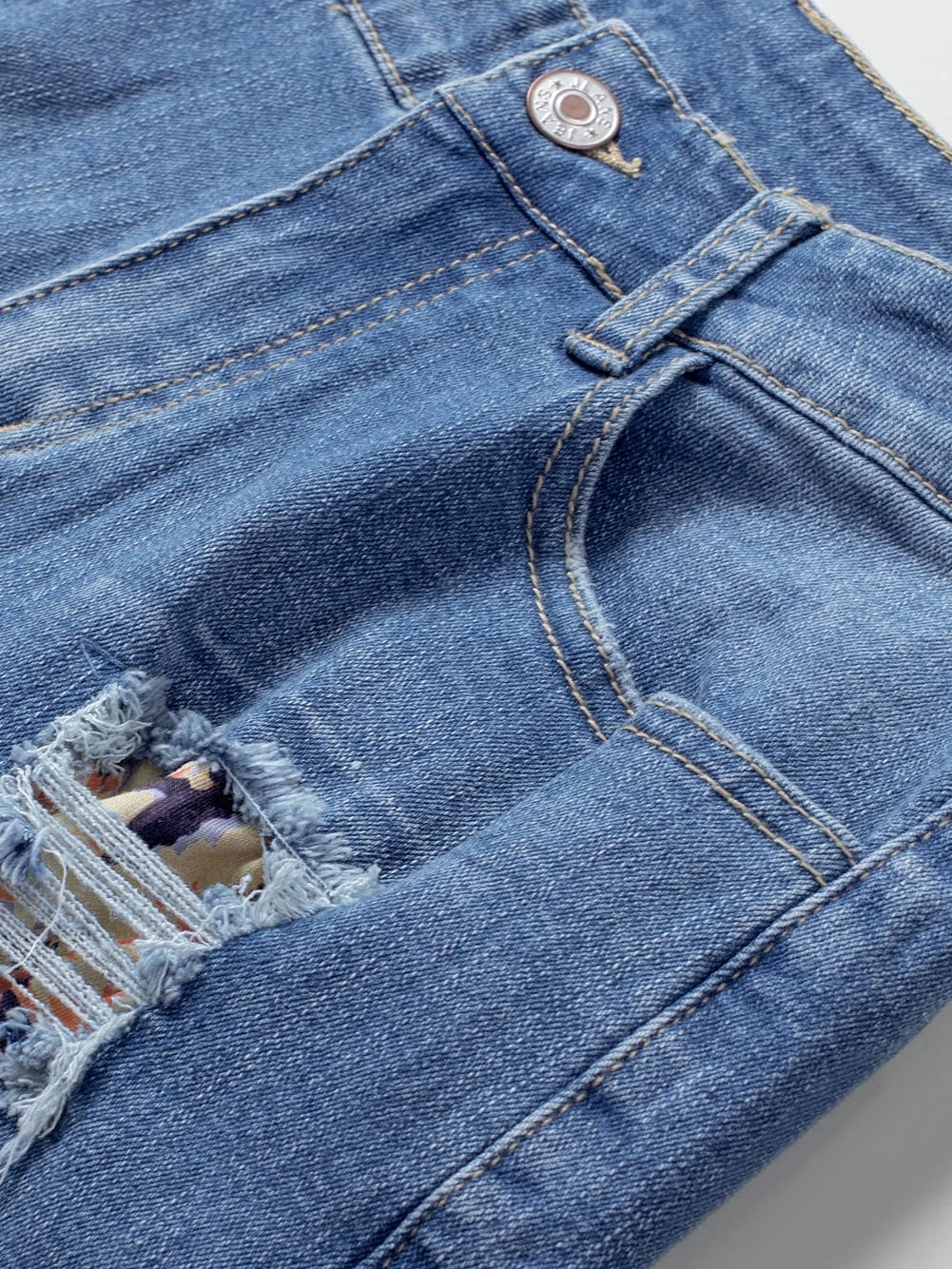 Trendy Ripped Denim Shorts with Unique Floral Design