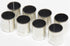 Set of metal bushings with black inserts on a white background
