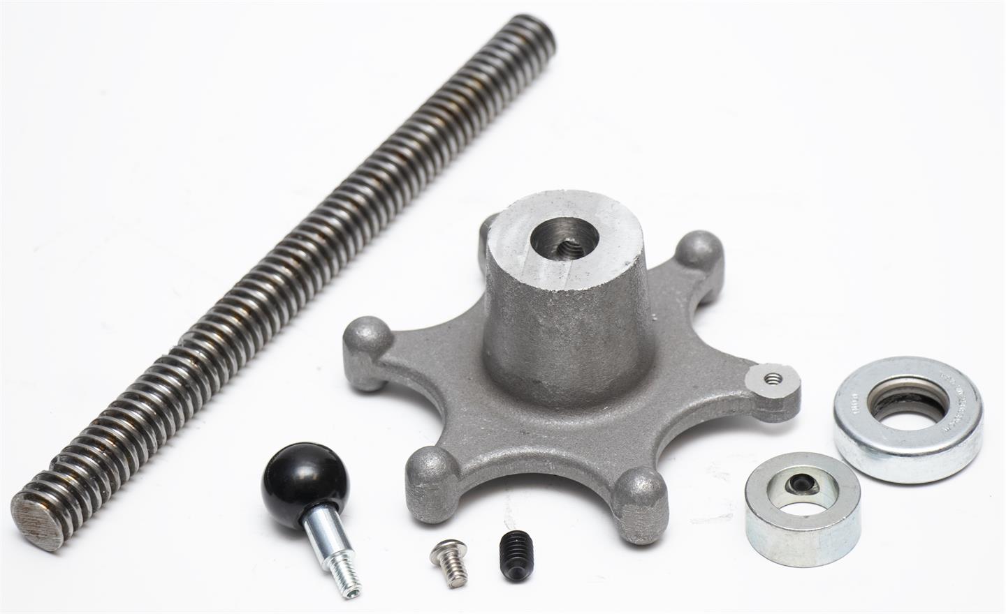 Mechanical components including a threaded rod, gear, and bearings on a white background