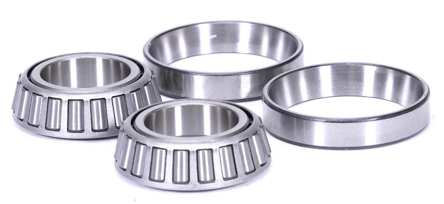 Four metallic bearings on a white background