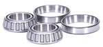 Four metallic bearings on a white background