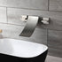 Grifo para lavabo de baño en cascada de níquel cepillado con desagüe emergente de latón y montaje en pared.