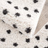 Alfombra de felpa con puntos blancos y negros Chaia