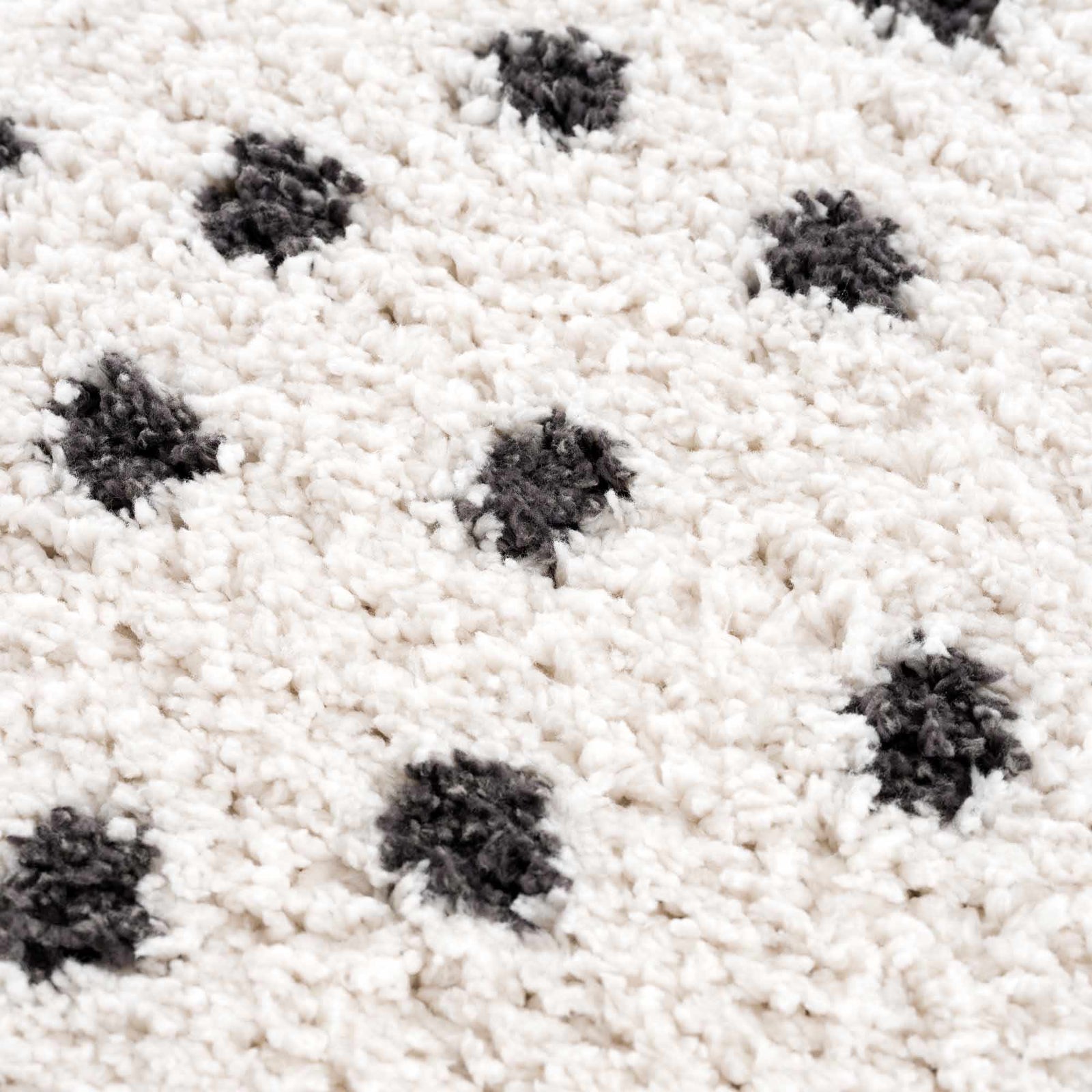 Alfombra de felpa con puntos blancos y negros Chaia