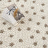 Alfombra de felpa con lunares color crema y marrón de Chaia