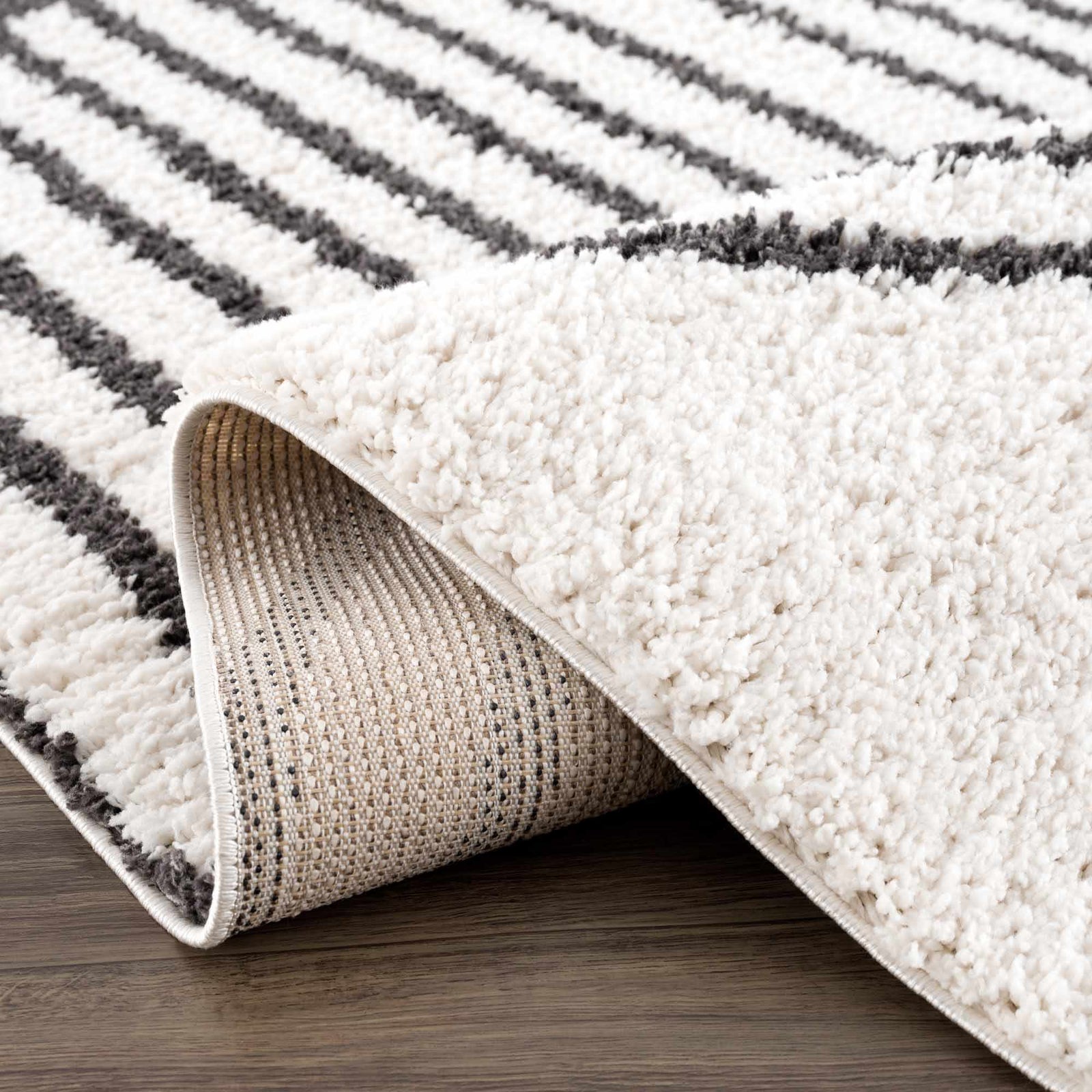 Alfombra de felpa negra con arcoíris de Bauer - Ofertas especiales