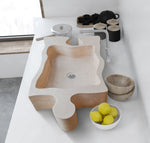 Lavabo de baño con forma de rompecabezas de travertino beige de piedra natural sobre tocador