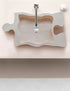 Lavabo de baño con forma de rompecabezas de travertino beige de piedra natural sobre tocador