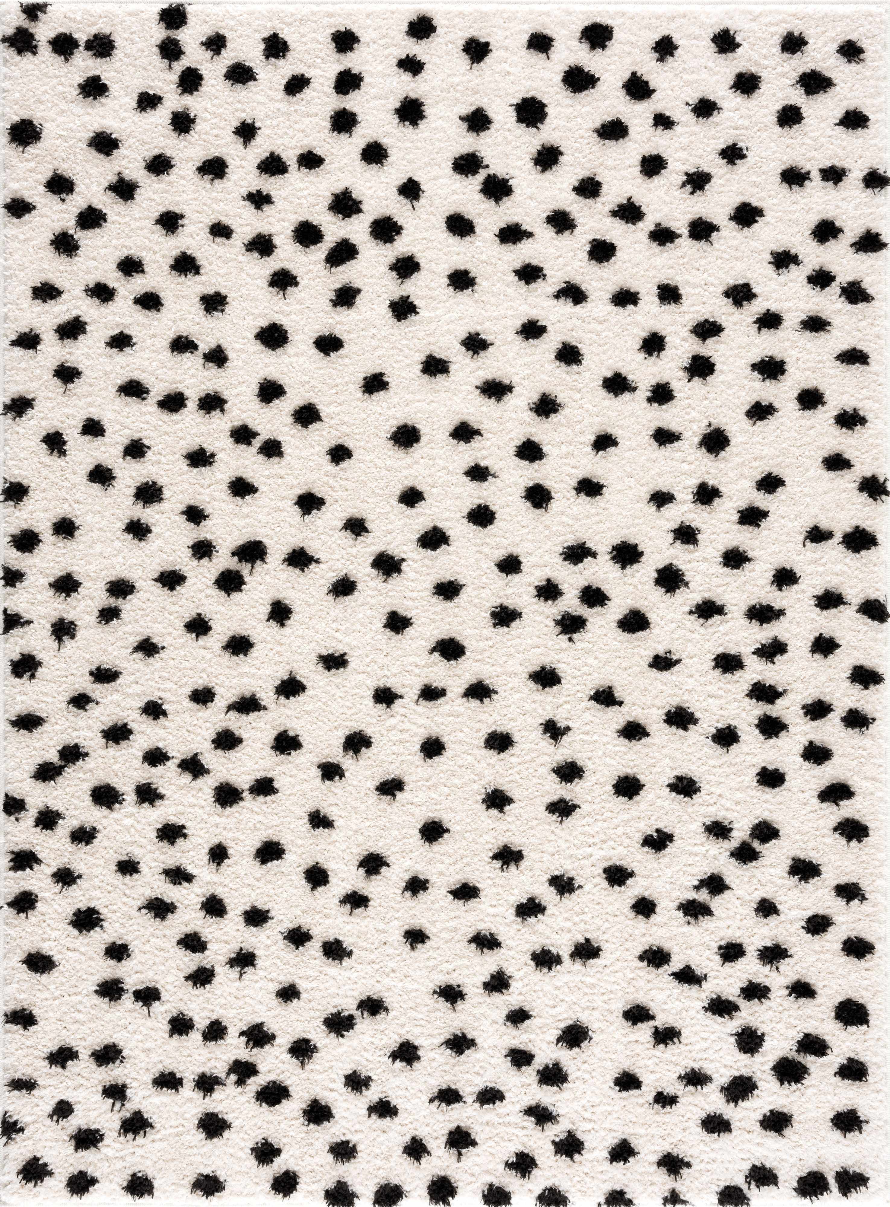 Alfombra de lunares blancos y negros de Cansu