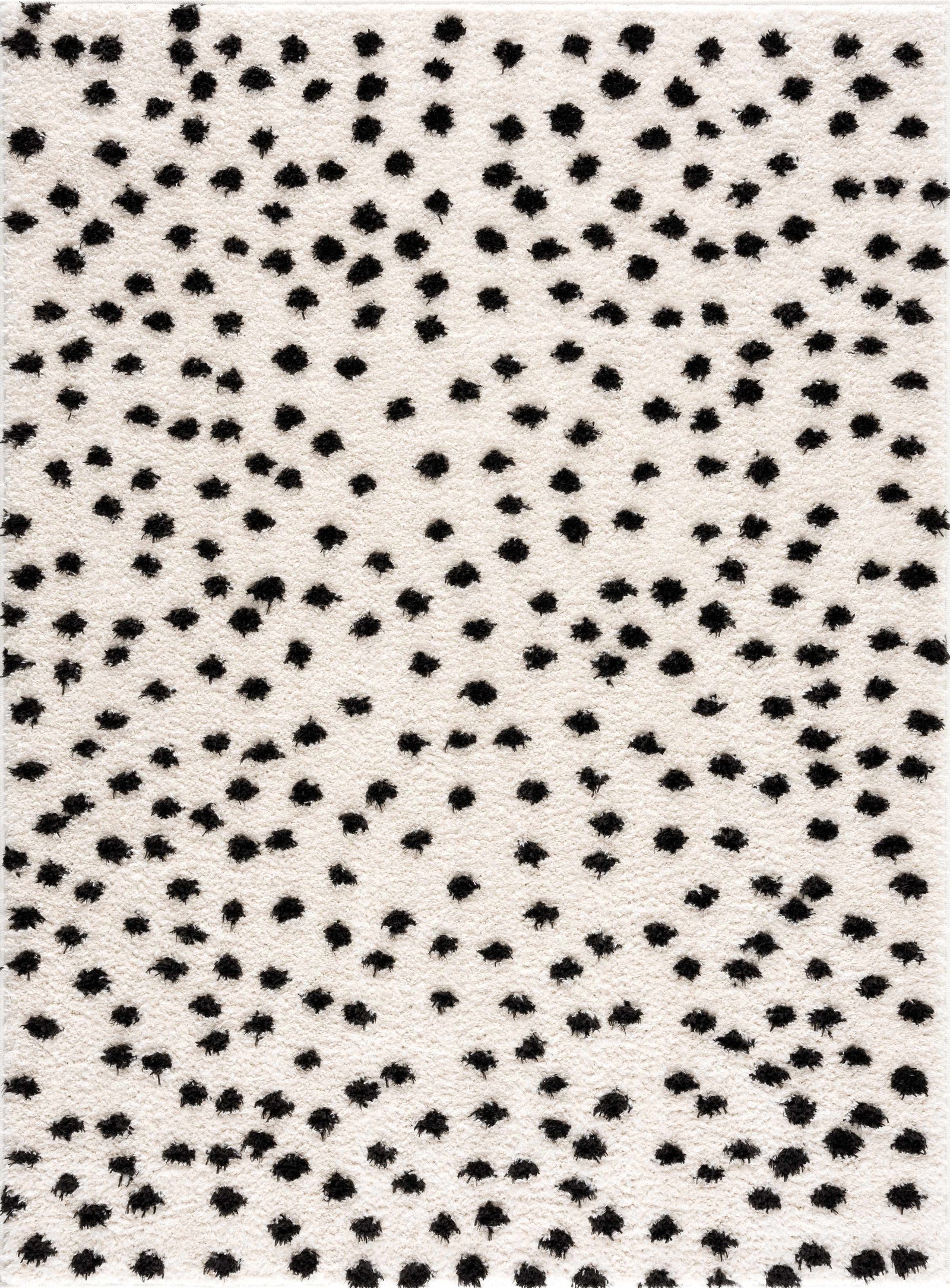 Alfombra de lunares blancos y negros de Cansu