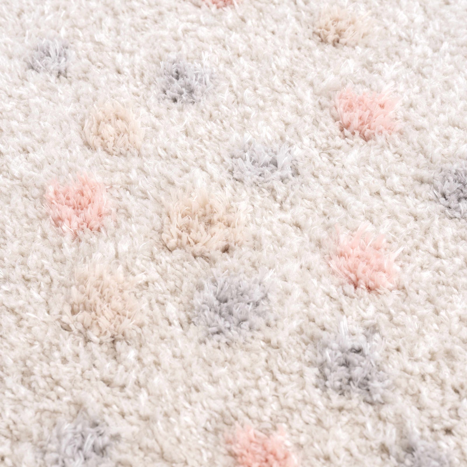 Alfombra con lunares en color rosa y crema de Cansu