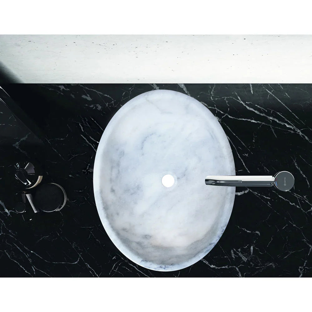 Lavabo ovalado de piedra natural de mármol blanco de Carrara sobre tocador de baño