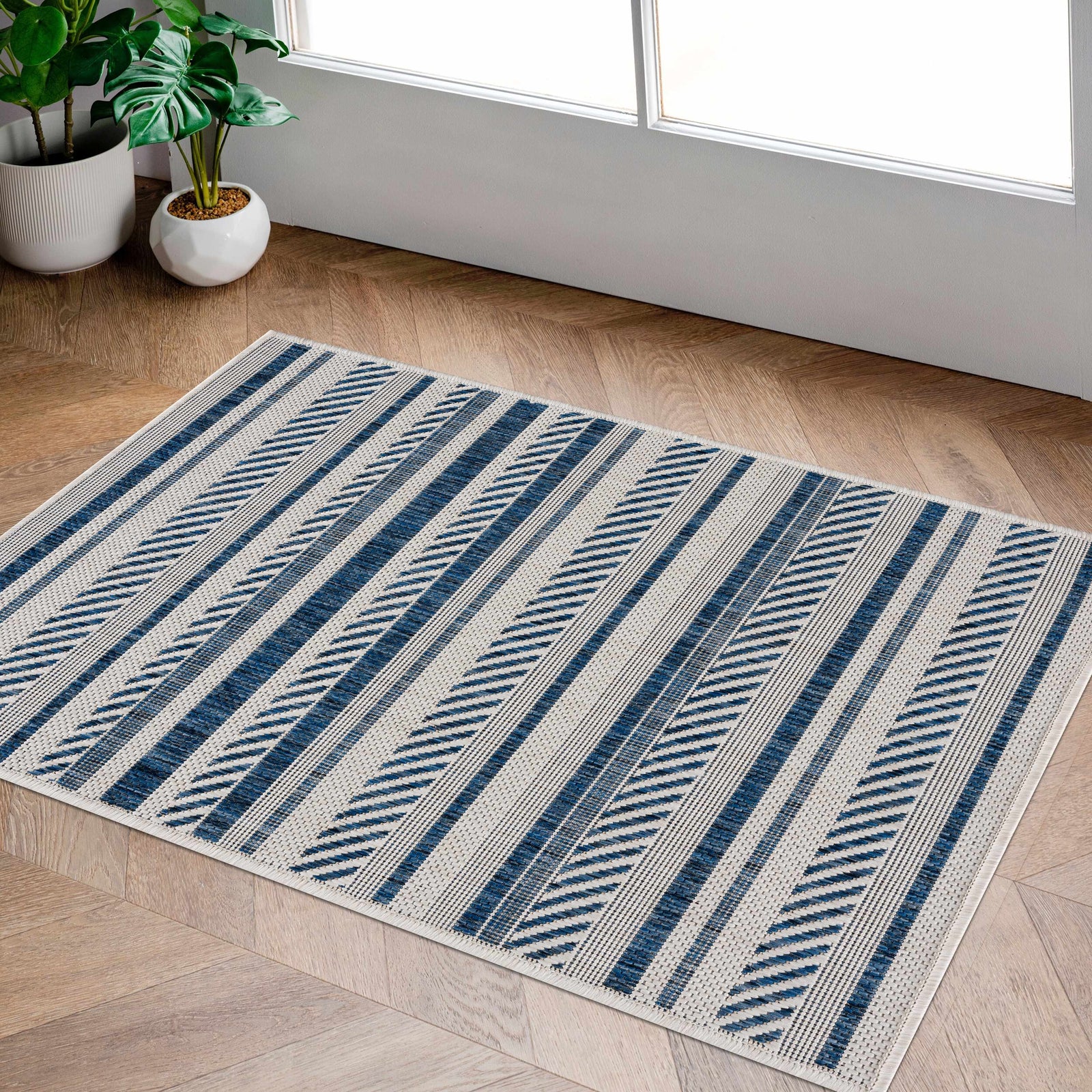 Alfombra nórdica de rayas blancas y azules Olin