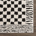 Alfombra de cuadros blancos y negros Leryn