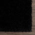 Alfombra peluda Faina de color negro liso lavable