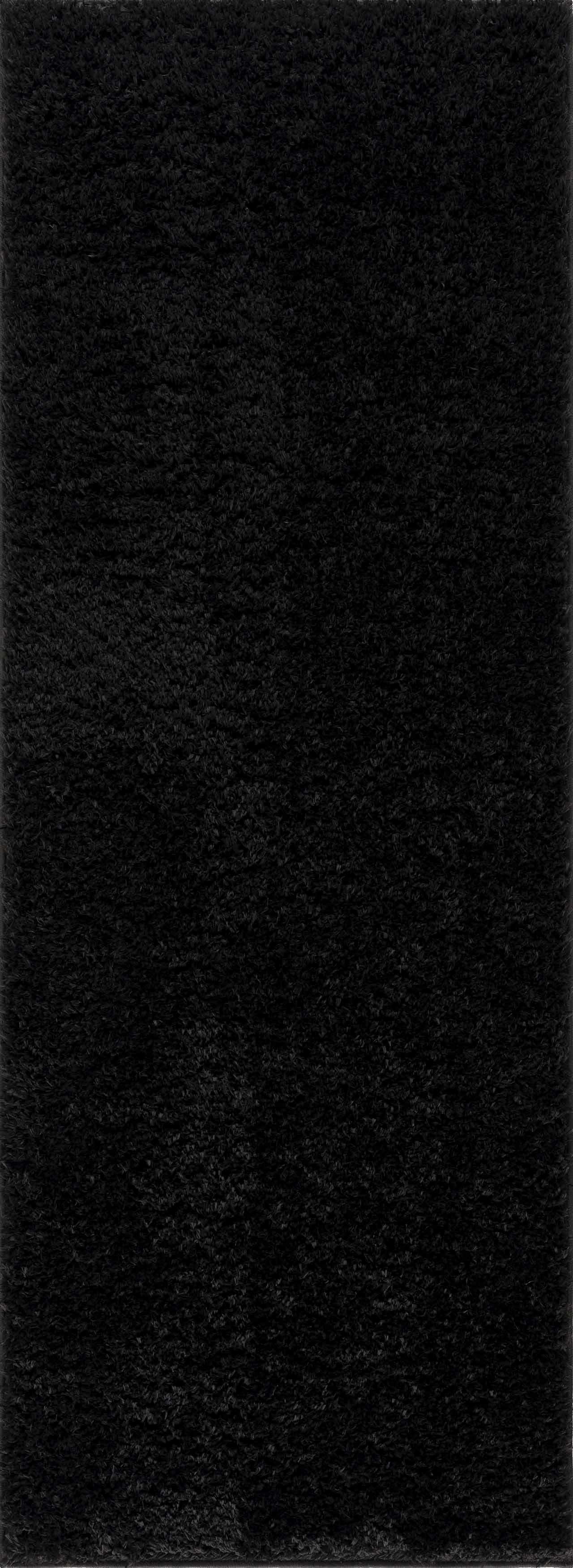 Alfombra peluda Faina de color negro liso lavable