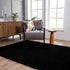Alfombra peluda Faina de color negro liso lavable