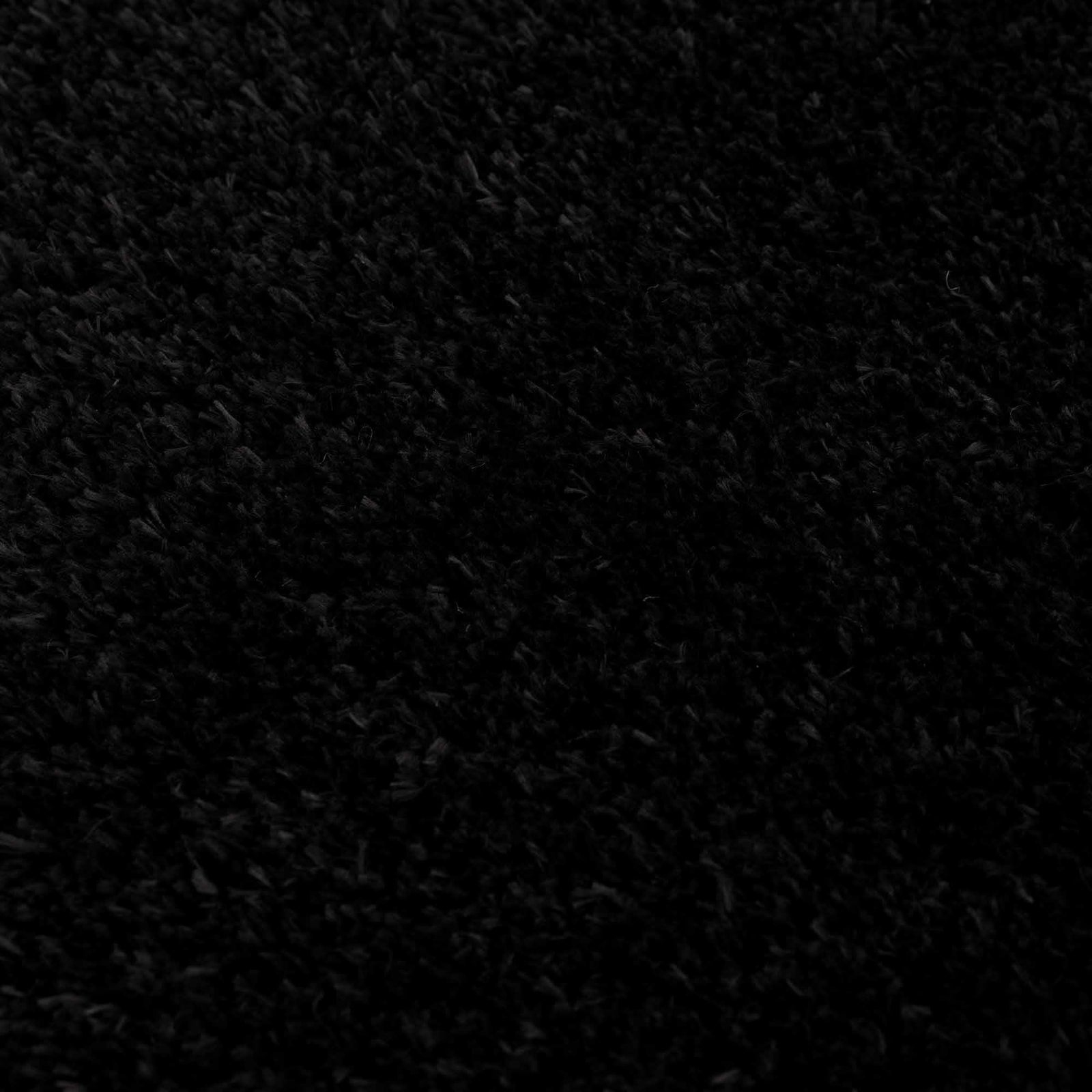 Alfombra peluda Faina de color negro liso lavable