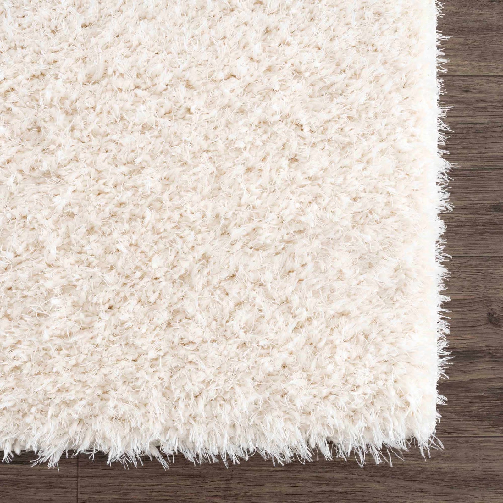 Alfombra peluda Faina de color crema sólido lavable