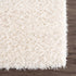 Alfombra peluda Faina de color crema sólido lavable