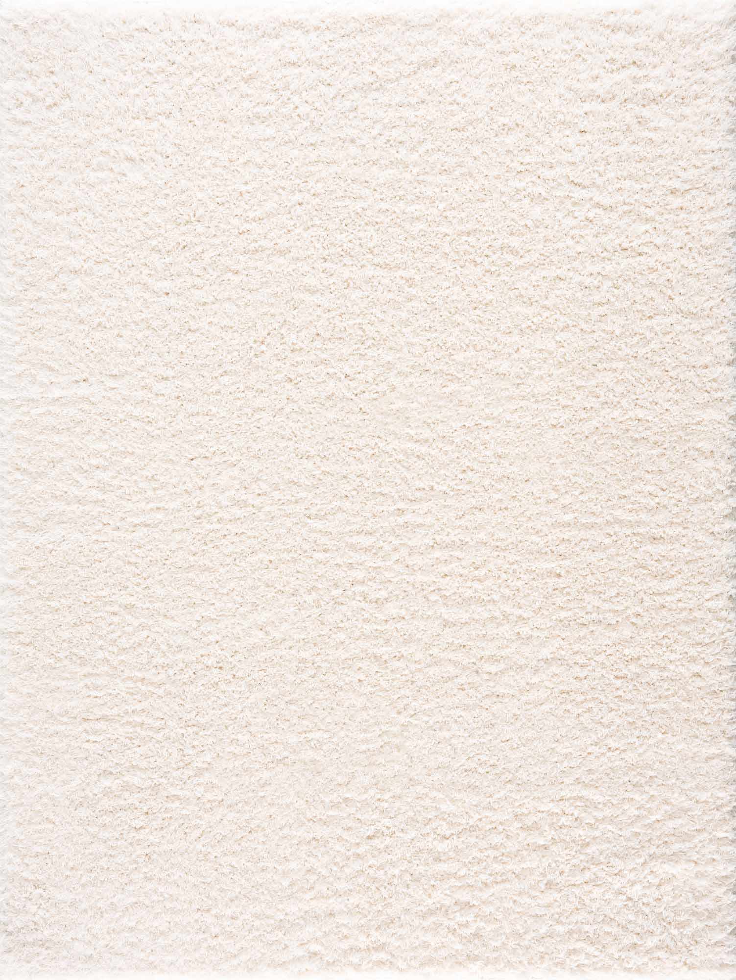 Alfombra peluda Faina de color crema sólido lavable