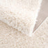 Alfombra peluda Faina de color crema sólido lavable