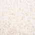 Alfombra peluda Faina de color crema sólido lavable