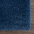Alfombra peluda Faina de color azul oscuro liso lavable