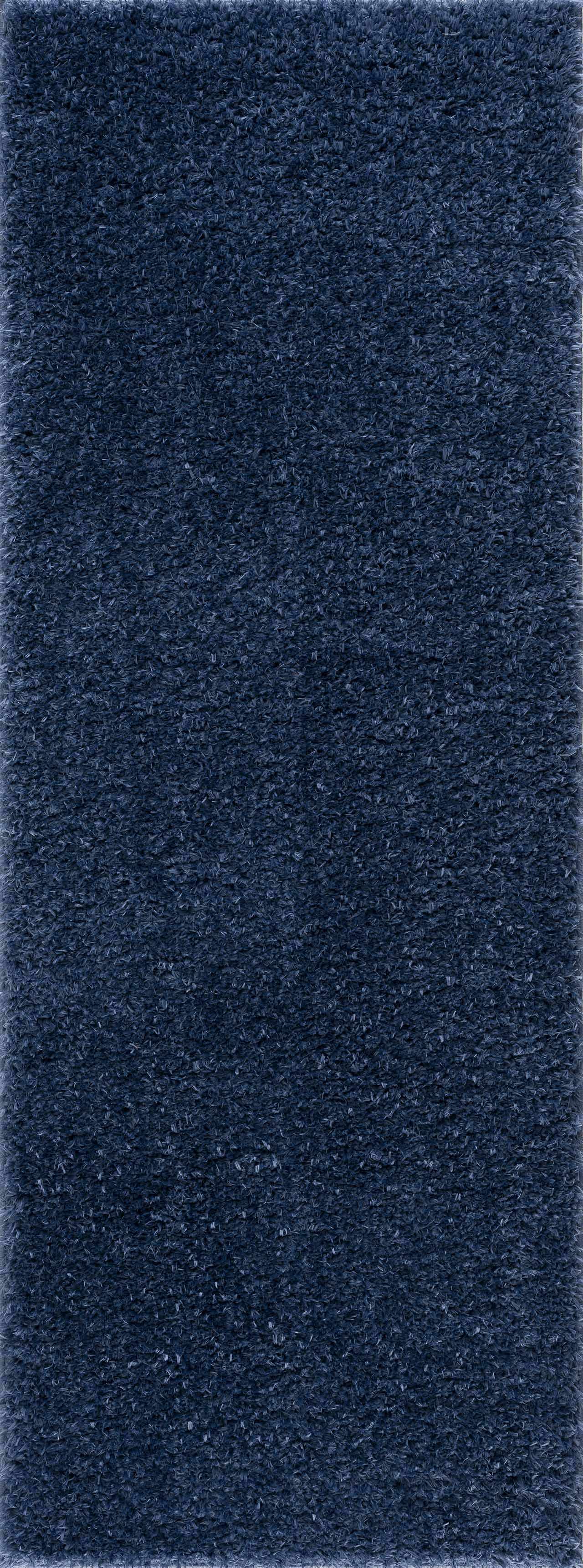 Alfombra peluda Faina de color azul oscuro liso lavable