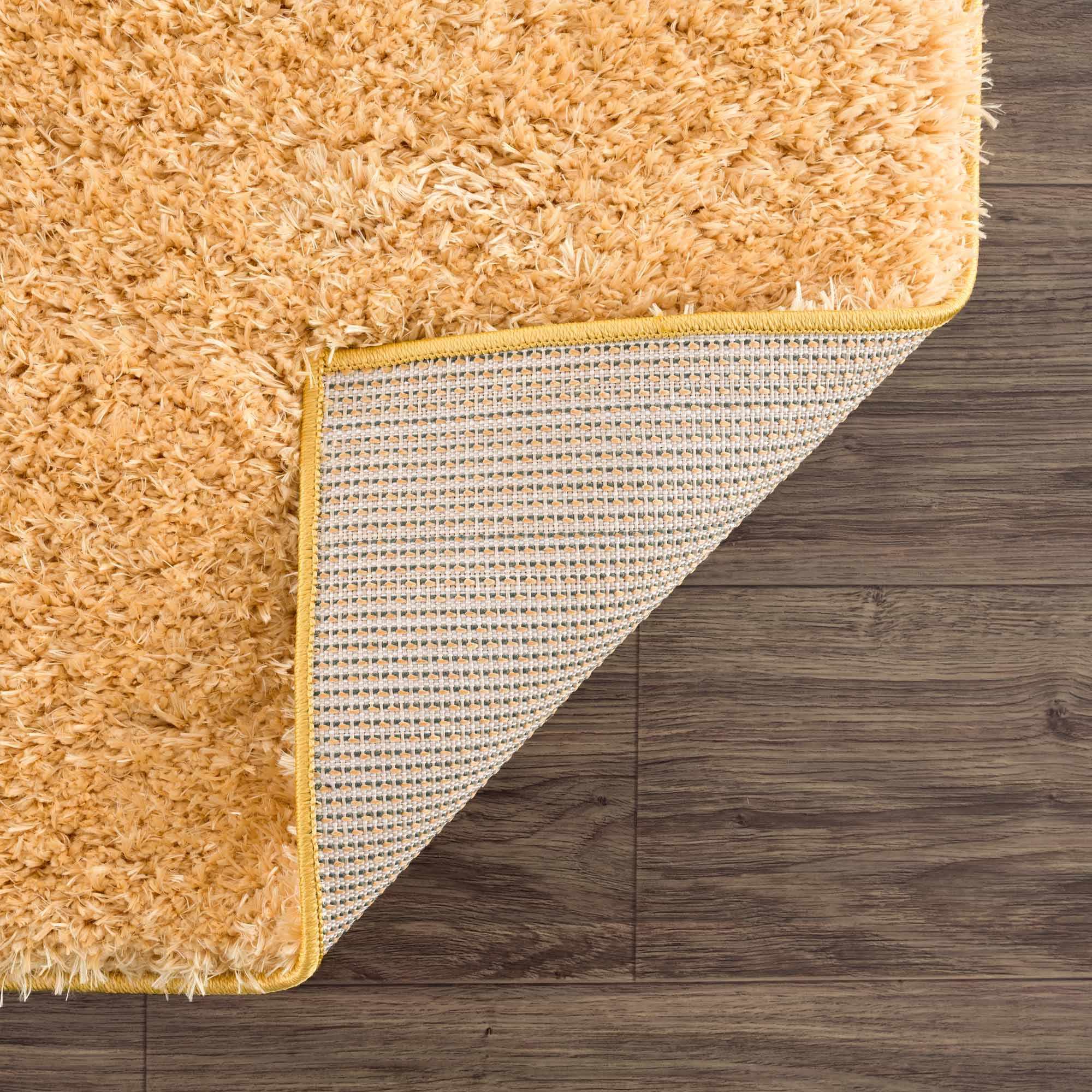 Alfombra de pelo largo Faina Solid Gold lavable