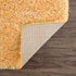 Alfombra de pelo largo Faina Solid Gold lavable