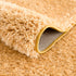 Alfombra de pelo largo Faina Solid Gold lavable