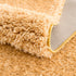 Alfombra de pelo largo Faina Solid Gold lavable
