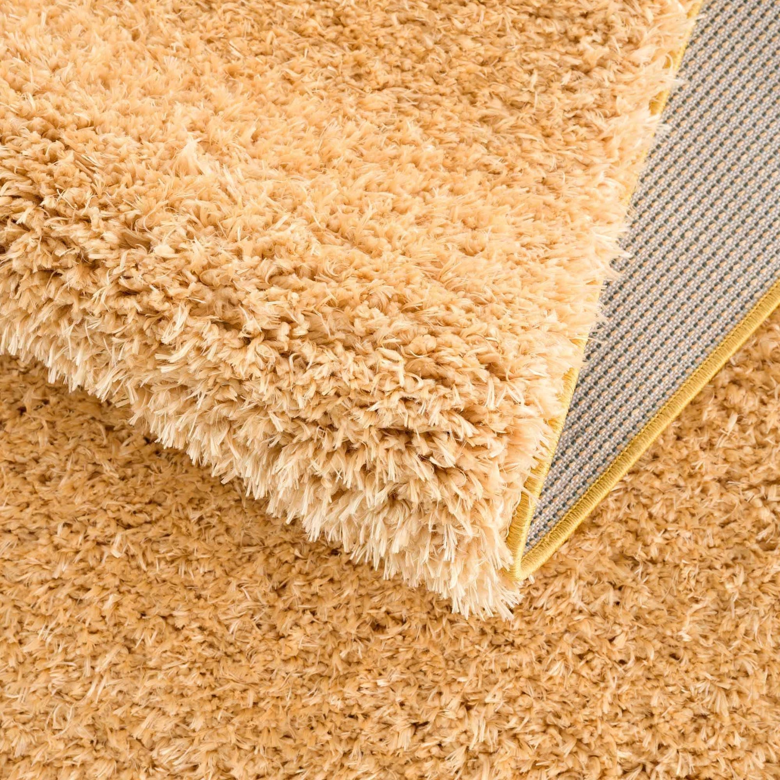 Alfombra de pelo largo Faina Solid Gold lavable