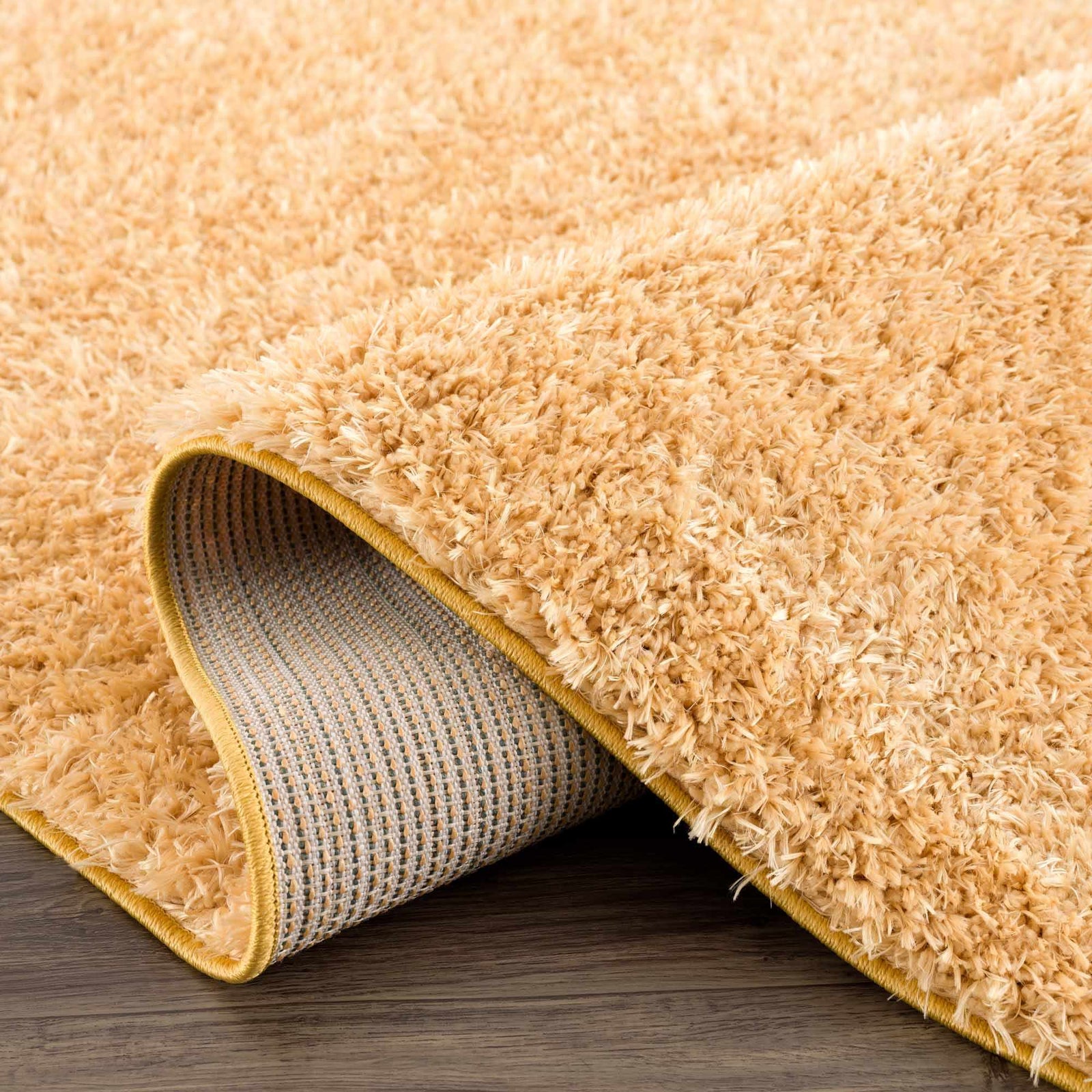 Alfombra de pelo largo Faina Solid Gold lavable