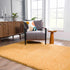 Alfombra de pelo largo Faina Solid Gold lavable