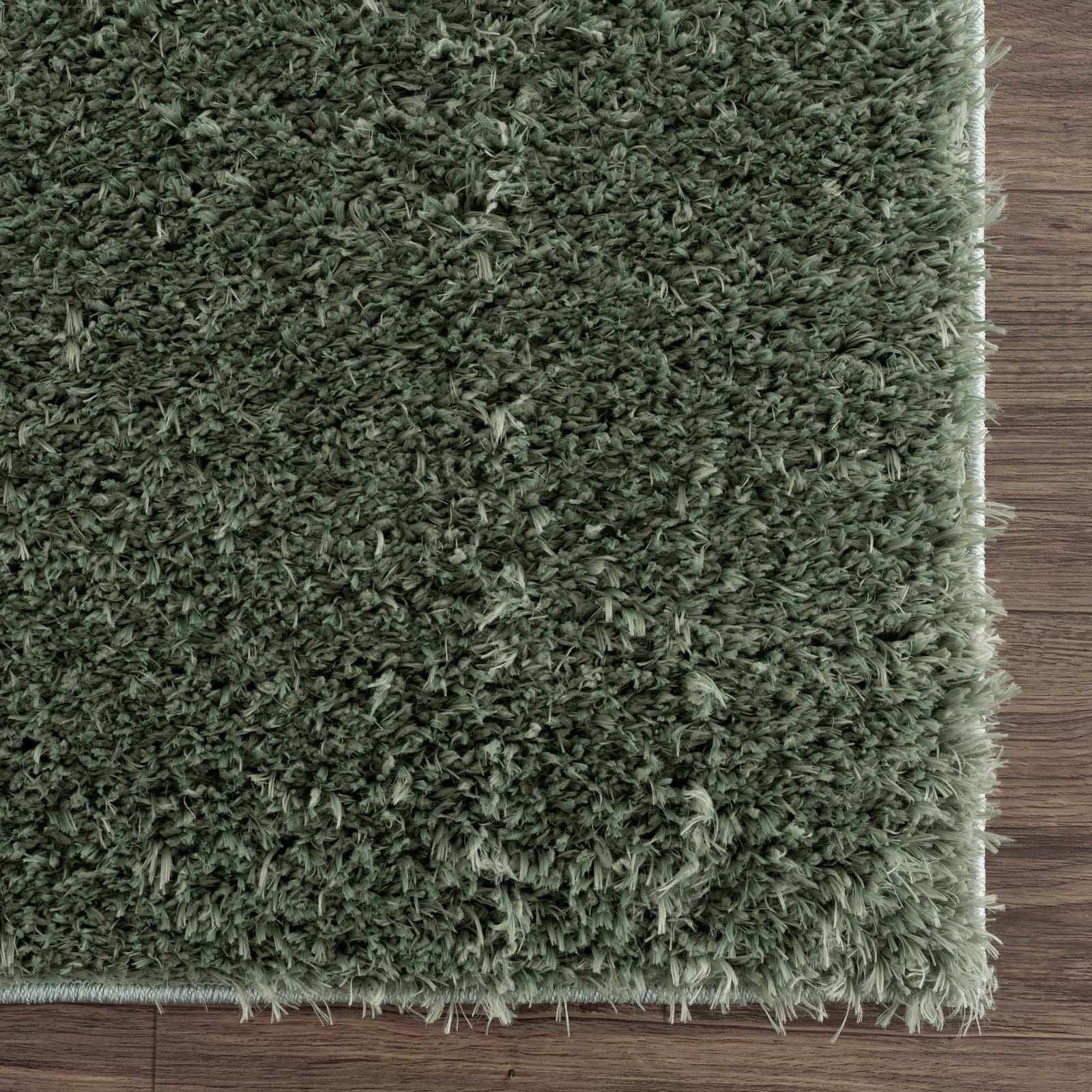 Alfombra peluda lavable Faina de color verde sólido