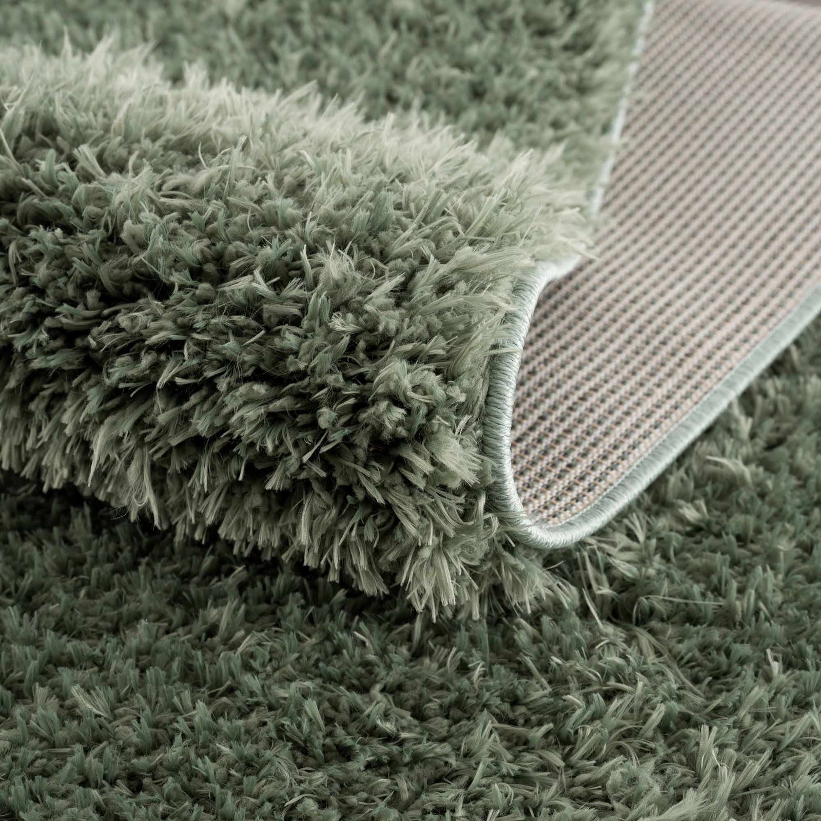 Alfombra peluda lavable Faina de color verde sólido