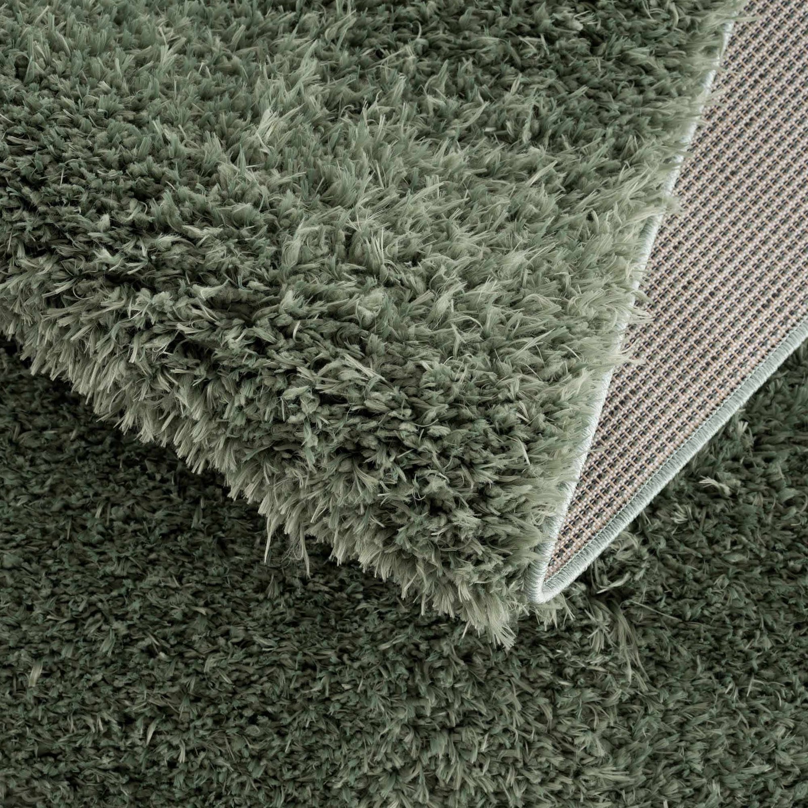 Alfombra peluda lavable Faina de color verde sólido