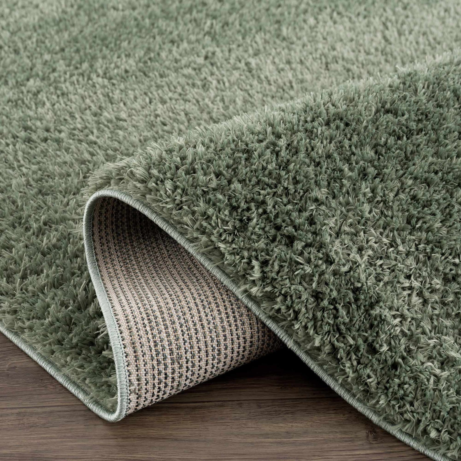 Alfombra peluda lavable Faina de color verde sólido