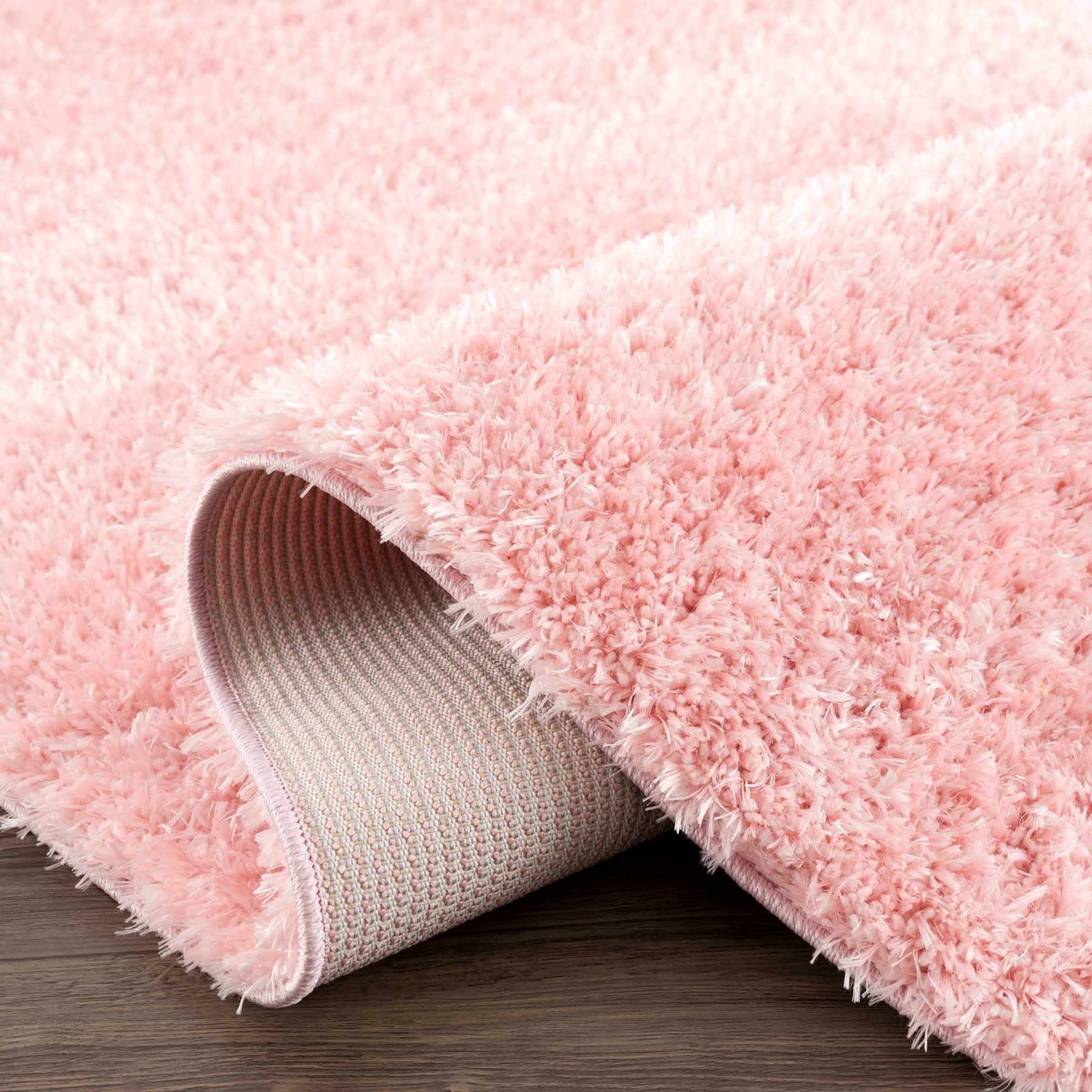 Alfombra peluda lavable Faina de color rosa sólido