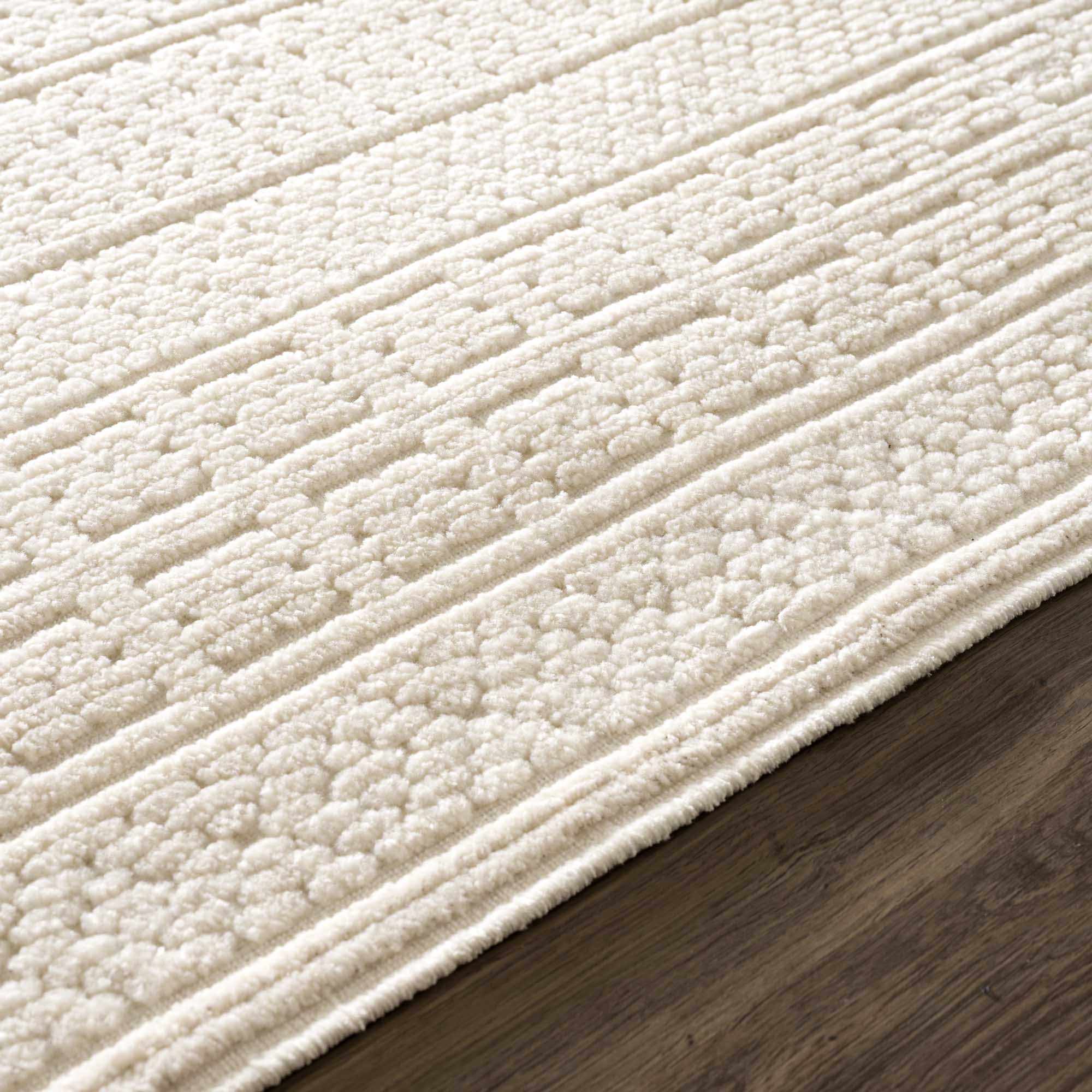 Alfombra lavable de color crema Bahar