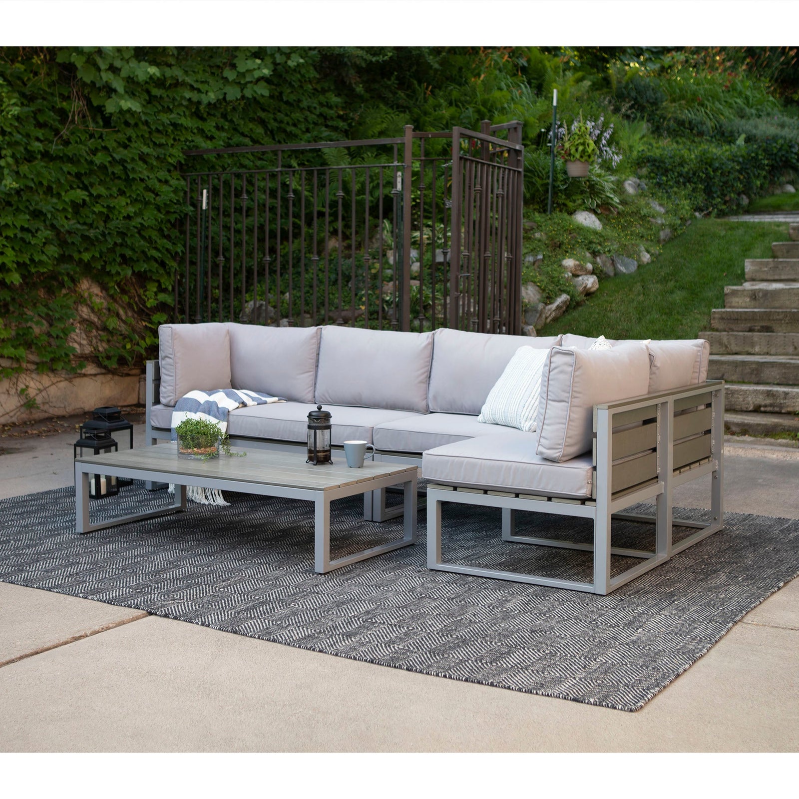 Juego de muebles de exterior para patio Jane de 4 piezas con cojines