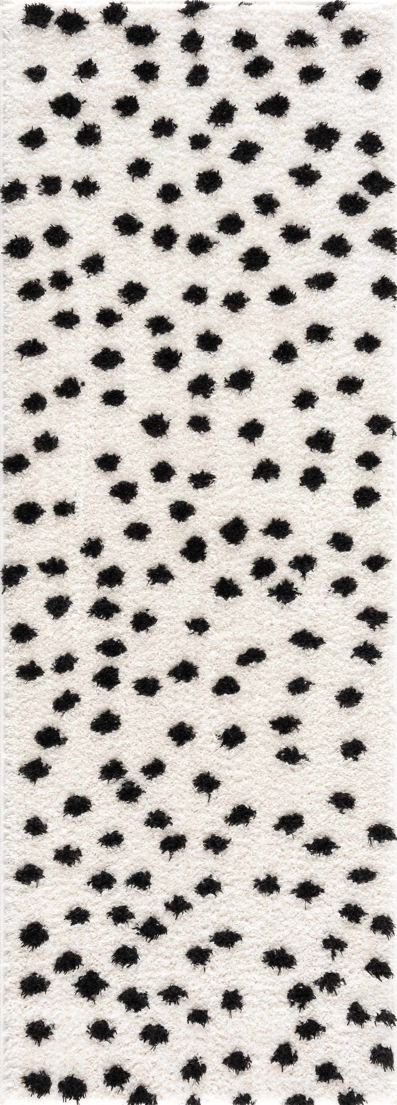 Alfombra de lunares blancos y negros de Cansu
