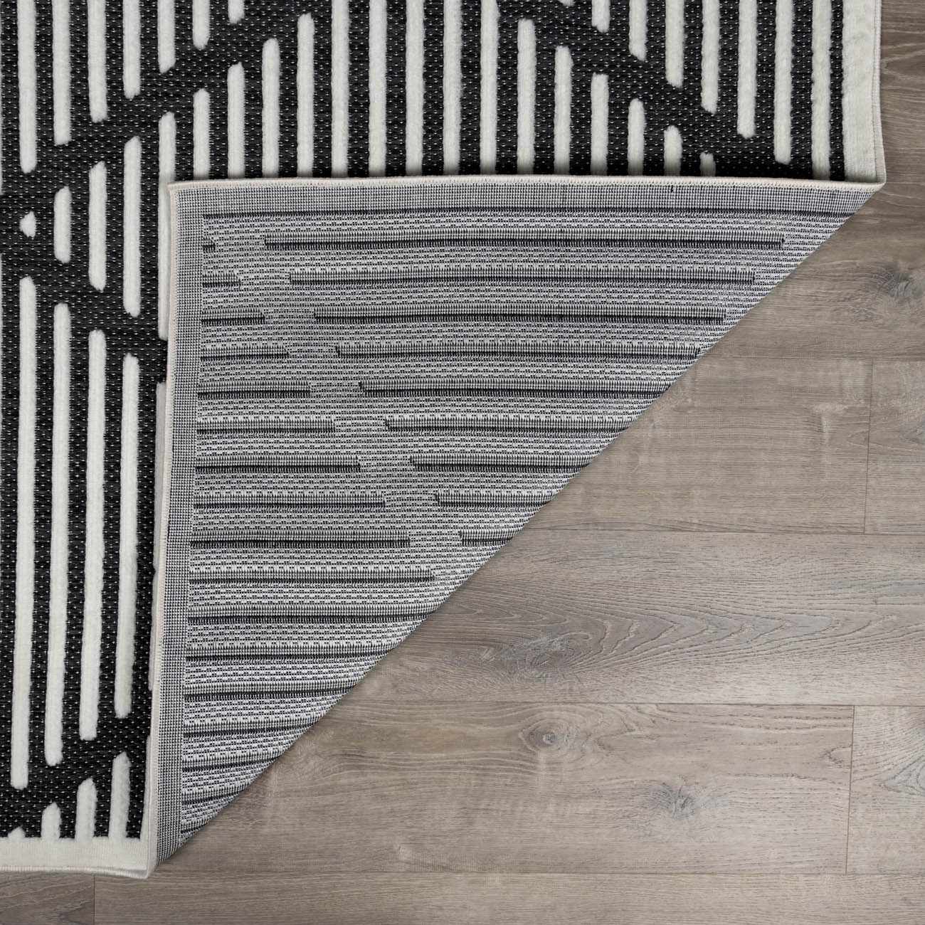 Alfombra duradera negra Anah