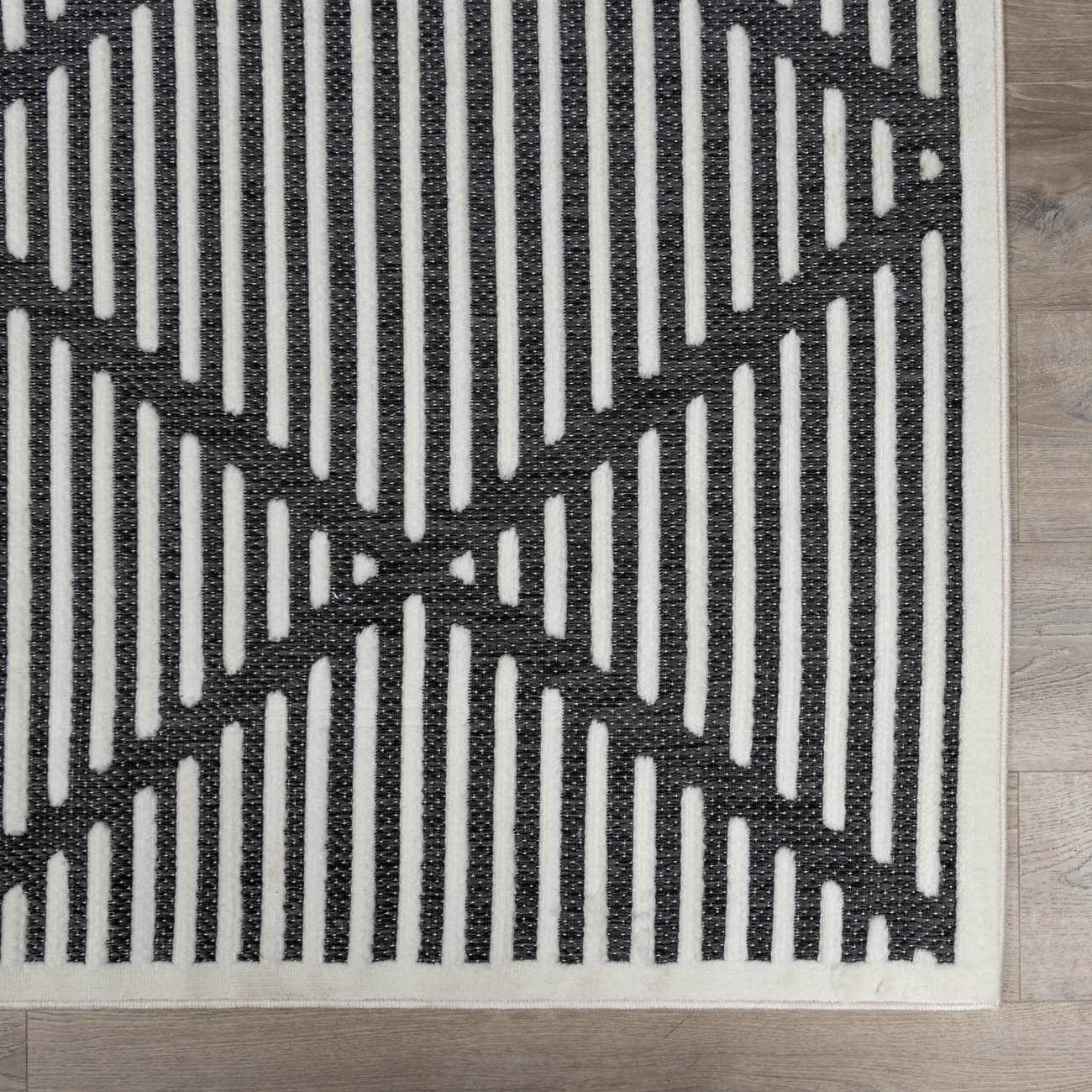 Alfombra duradera negra Anah