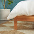 Cama Elias de madera maciza con cabecero arqueado