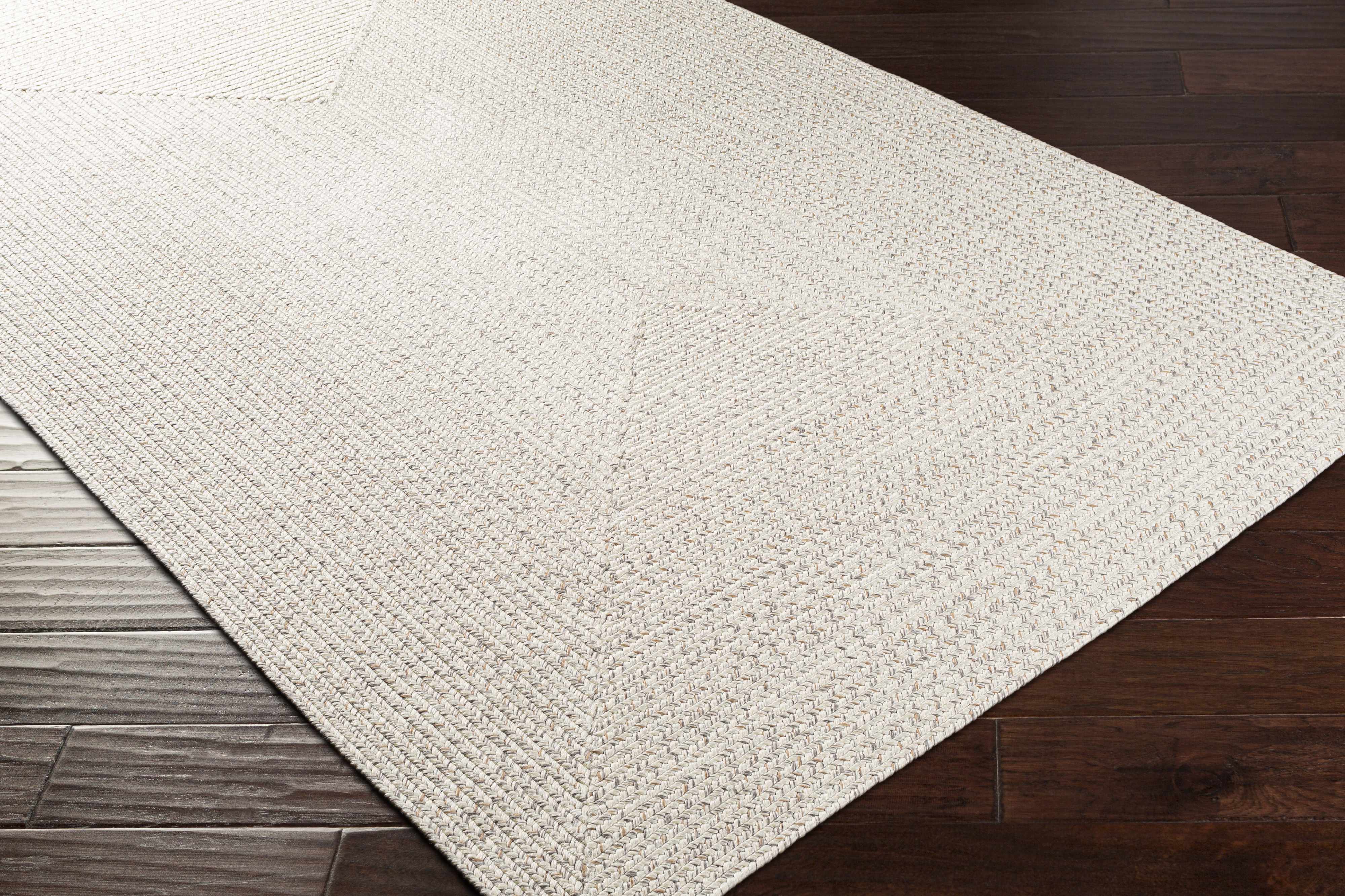 Alfombra trenzada de yute sintético de color beige