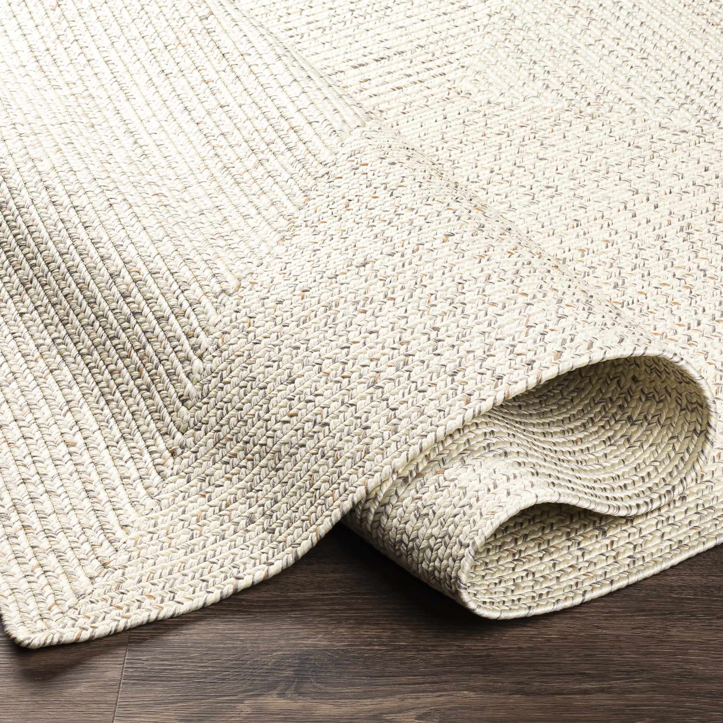 Alfombra trenzada de yute sintético de color beige